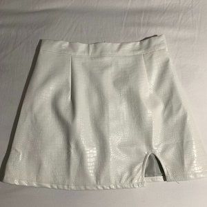 Body-con leather snake print mini skirt with side slit